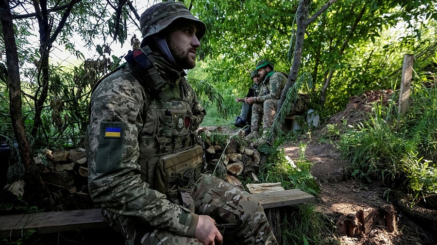 Ukrainian service members are seen on their position at a front line, amid Russia's attack on Ukraine, in Donetsk region. Credit: Reuters Photo