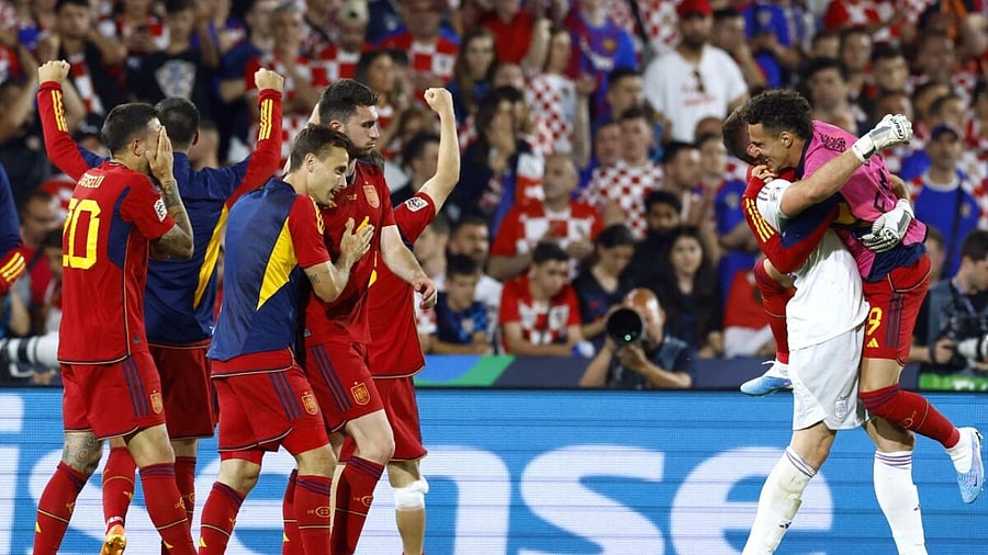 Spain's Rodrigo and Aymeric Laporte celebrate with teammates after winning the penalty shootout and the UEFA Nations League final. Credit: Reuters Photo