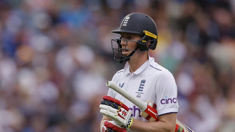  England's Zak Crawley walks after losing his wicket, caught by Australia's Alex Carey off the bowling of Scott Boland. Credit: Reuters Photo