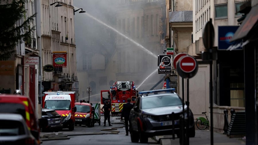 French firefighters work after several buildings on fire following a gas explosion in the fifth arrondissement of Paris, France. Credit: Reuters Photo