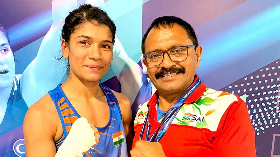 Indian boxer Nikhat Zareen with coach Bhaskar Bhatt. Credit: PTI File Photo