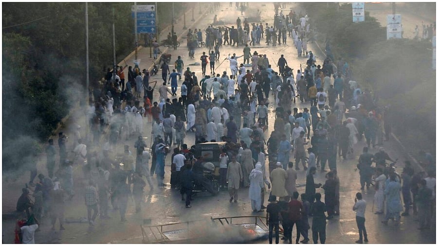 Supporters of Pakistan's former Prime Minister Imran Khan block a highway, during a protest against his arrest, in Karachi, Pakistan May 9, 2023. Credit: Reuters Photo