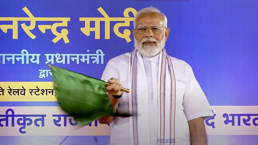 <div class="paragraphs"><p>File photo of PM Modi flagging off a Vande Bharat Express train. </p></div>