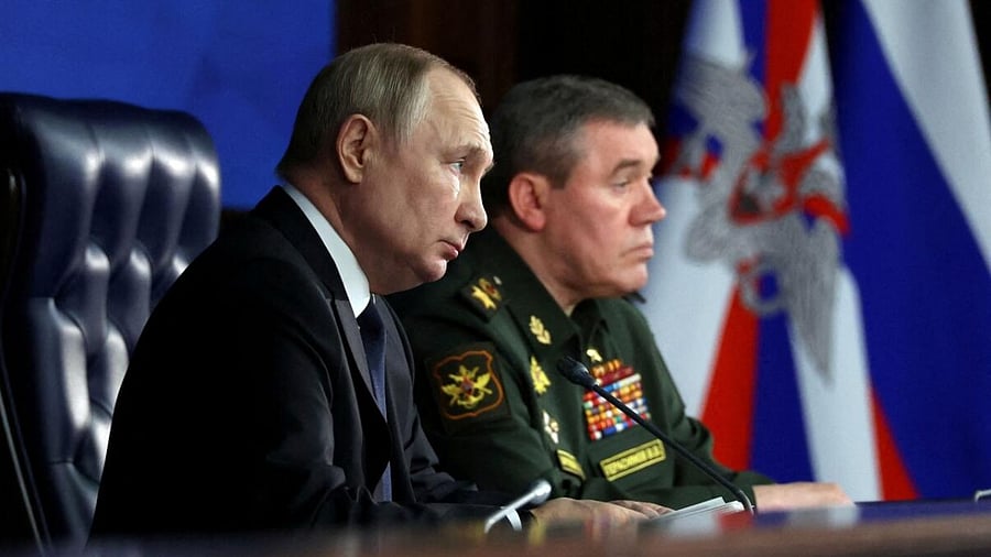 Russian President Vladimir Putin and Chief of the General Staff of Russian Armed Forces Valery Gerasimov attend an annual meeting of the Defence Ministry Board in Moscow, Russia, December 21, 2022. Credit: Reuters Photo