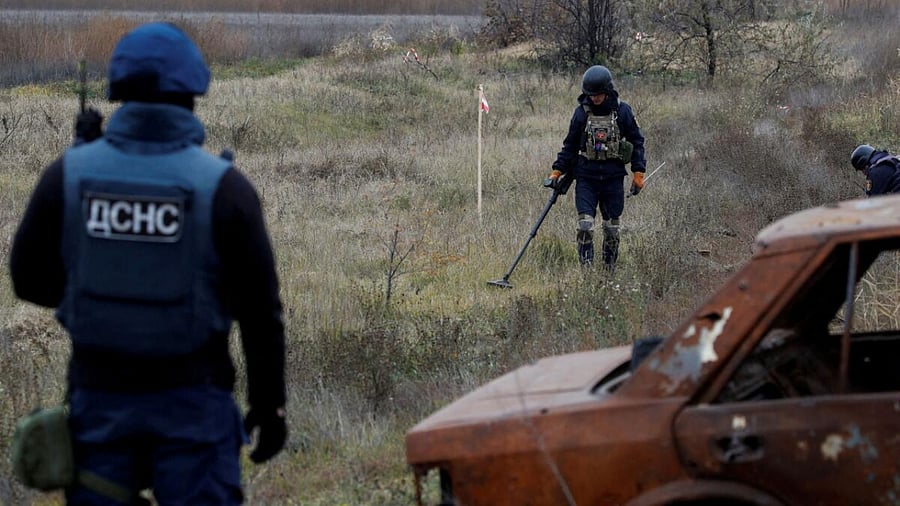 Ukrainian mine experts scan for unexploded ordnance and landmines by the main road to Kherson, Ukraine November 16, 2022. Credit: Reuters File Photo