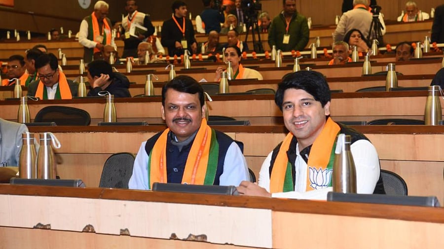 Maharashtra Deputy Chief Minister Devendra Fadnavis (L) and BJP spokesperson Shehzad Poonawalla (R). Credit: Twitter/@Shehzad_Ind.