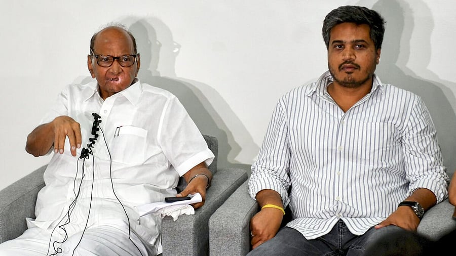 Nationalist Congress Party (NCP) President Sharad Pawar with party MLA Rohit Pawar speaks during a press conference at his residence, in Pune, Sunday, July 2, 2023. Credit: PTI Photo