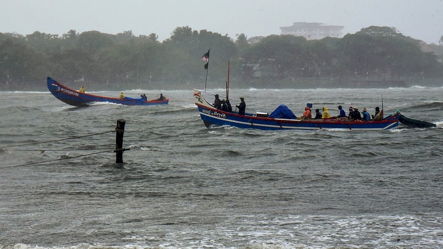 Fishing boats are seen amid high tides and monsoon rain, in Kochi, Tuesday, June 27, 2023. Credit: PTI Photo