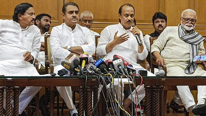 Maharashtra Deputy Chief Minister Ajit Pawar with Chhagan Bhujbal, Praful Patel, Sunil Tatkare and others during a press conference. Credit: PTI Photo