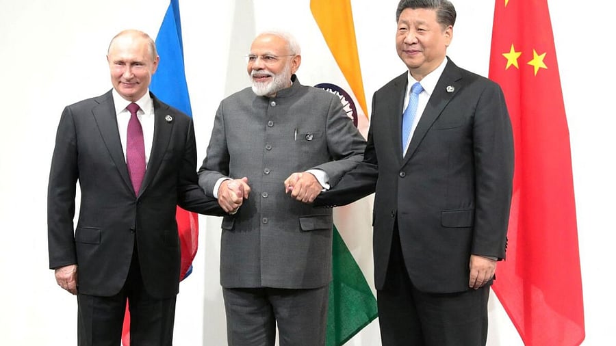  Russia's President Vladimir Putin (L), India's Prime Minister Narendra Modi (C) and China’s President Xi Jinping pose for a picture during a meeting on the sidelines of the G20 summit in Osaka, Japan June 28, 2019. Credit: Reuters Photo