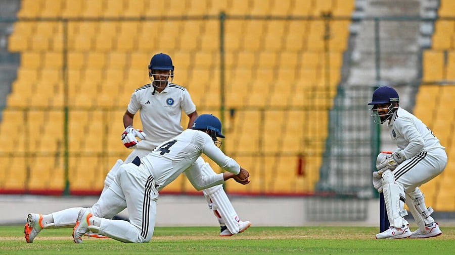 North Zone's Ankit Kumar takes a fine catch at short leg to dismiss South Zone's Mayank Agarwal on the second day of the Duleep Trophy semifinal match at the M Chinnaswamy Stadium in Bengaluru on Thursday. Credit: DH Photo 