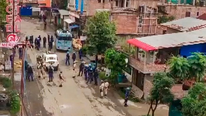 Security forces personnel guard after a mob allegedly attempted to loot weapons from an India Reserve Battalion located in Khangabok, in Thoubal district of Manipur, Tuesday, July 4, 2023. Credit: PTI Photo 
