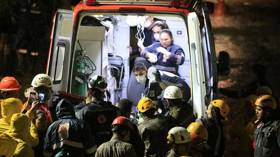 Rescue workers carry an injured person found among debris after a building collapsed in Recife Pernambuco state, Brazil July 7, 2023. Credit: Reuters Photo
