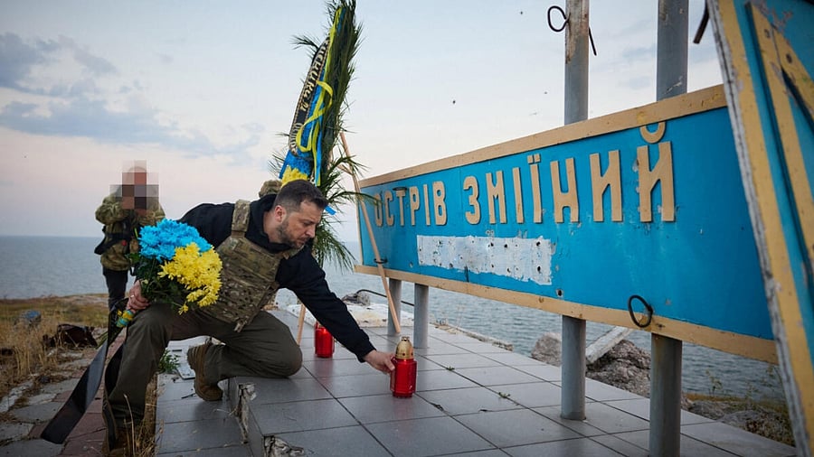 Ukraine's President Volodymyr Zelenskyy pays tribute to fallen defenders of the country as he visits Snake (Zmiinyi) Island in the Black Sea. Credit: Reuters Photo