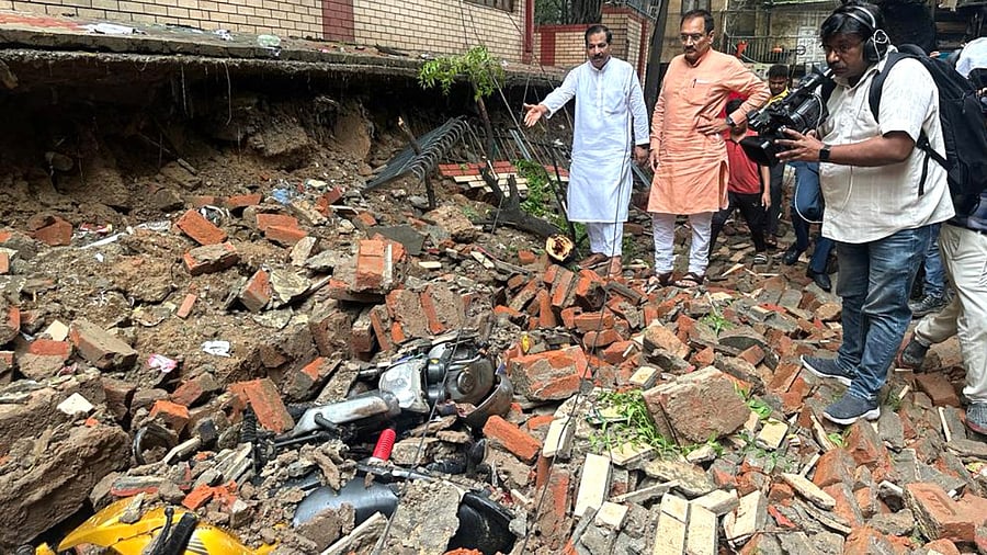Delhi BJP President Virendra Sachdeva visits the site after a wall of a government school collapsed following monsoon rains, in New Delhi. Credit: IANS/@Virend_Sachdeva