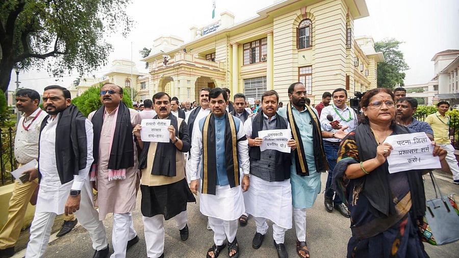 BJP MLAs wear black scarves to protest against police action on party supporters during their Vidhan Sabha March on Thursday. Credit: PTI Photo
