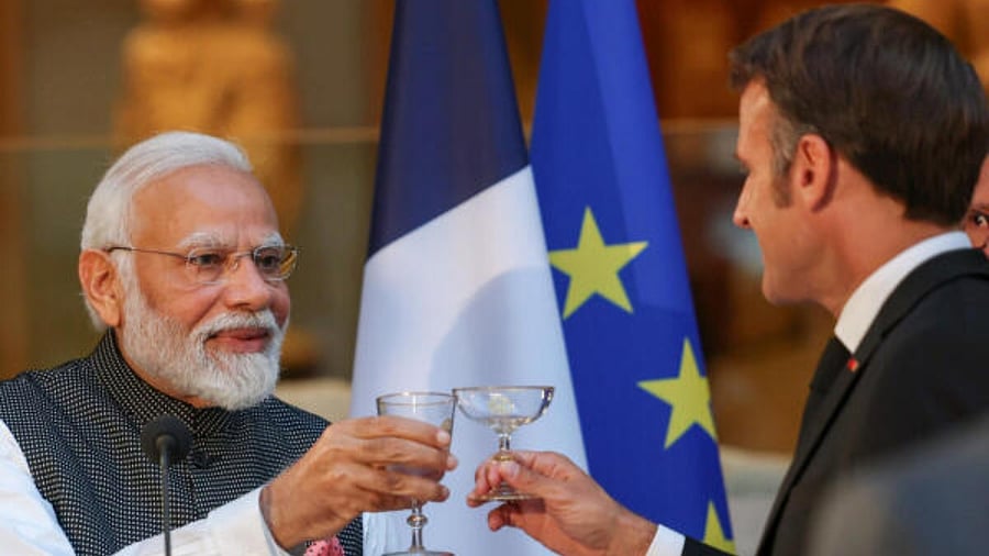 Prime Minister Narendra Modi with the French President Emmanuel Macron for a State Banquet at the Louvre Museum. Credit: PTI Photo