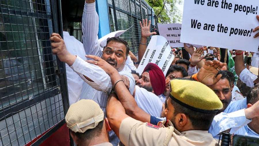 PDP workers being detained by police in Jammu. Credit: PTI Photo