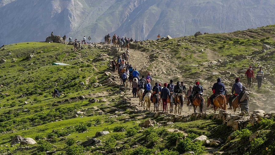Devotees during the pilgrimage to the holy cave shrine of Amarnath, in Jammu and Kashmir. Credit: PTI Photo