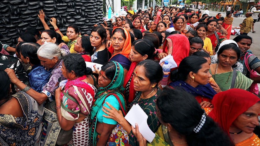Pilgrims wait in queue during registration for the Amarnath Yatra 2023 at Vaishnavi Dham registration center. Credit: PTI Photo