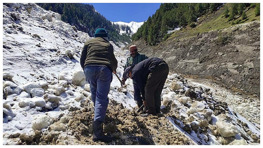 IPH department workers try to restore the drinking water supply after flood following heavy monsoon rains, at Sarchu in Lahaul Spiti, Saturday, July 15, 2023. Credit: PTI Photo