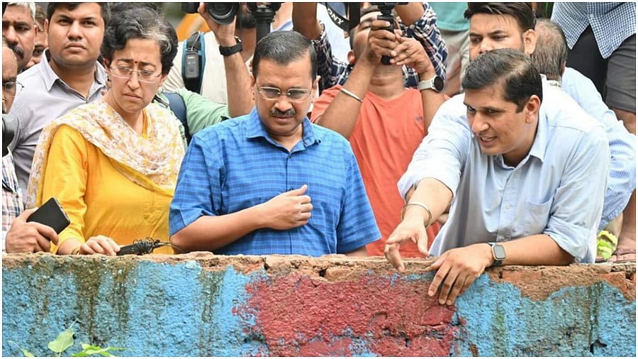 Delhi Chief Minister Arvind Kejriwal with Ministers Saurabh Bharadwaj and Atishi Singh inspects the broken barrage and improvement work of 12 number drain at Vikas Bhawan, ITO in New Delhi, Friday, July 14, 2023. Credit: Twitter/@AamAadmiParty