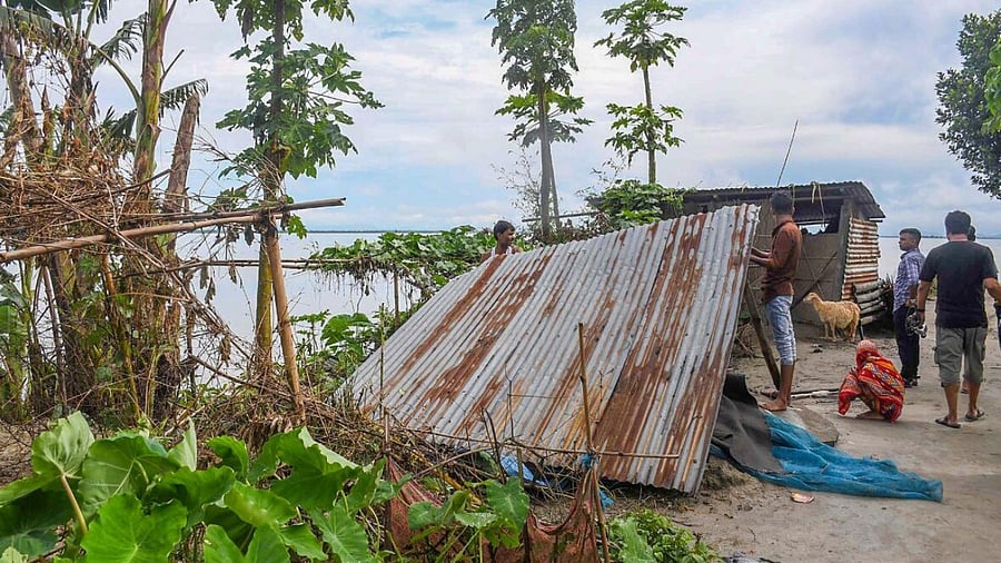 illagers prepare to shift to a safer place after water level of Brahmaputra river increased. Credit: PTI File Photo