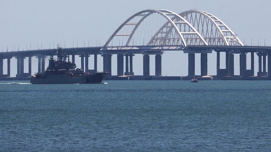 A Russian Navy amphibious landing ship that was deployed to transport cars across the Kerch Strait moves near the Crimean Bridge. Credit: Reuters Photo