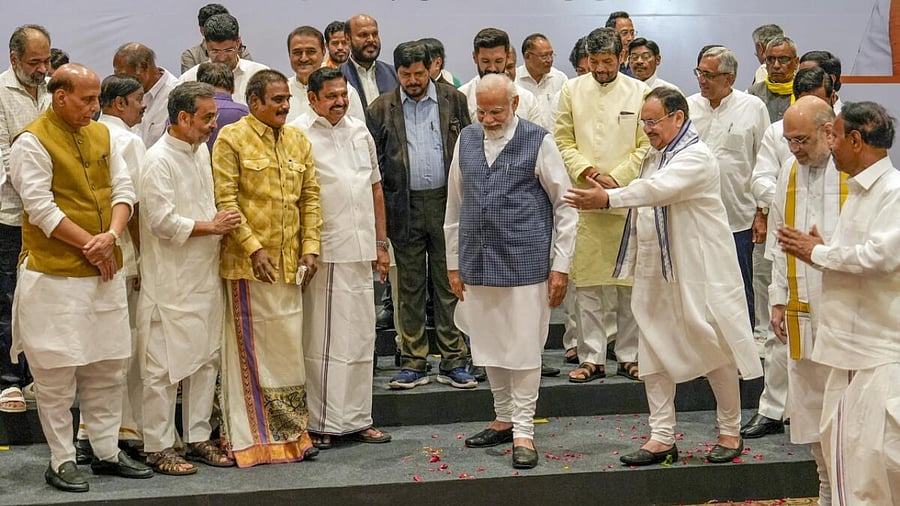 Prime Minister Narendra Modi being welcomed by NDA leaders during the meeting. Credit: PTI Photo