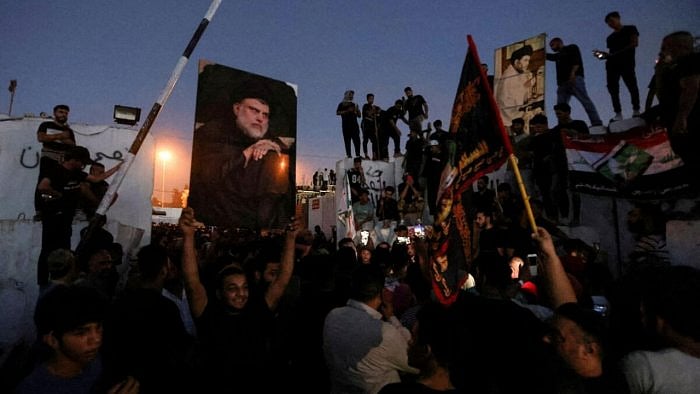 Protesters gather near the Swedish embassy in Baghdad hours after the embassy was stormed and set on fire ahead of an expected Koran burning in Stockholm, in Baghdad, Iraq, July 20, 2023. Credit: Reuters Photo  