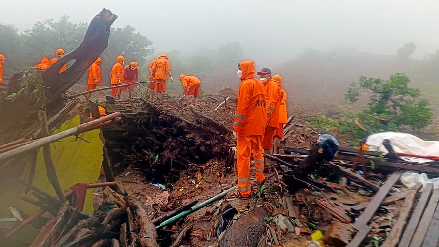 NDRF personnel during a search and rescue operation after a landslide at Irshalwadi village in Raigad district. Credit: PTI Photo