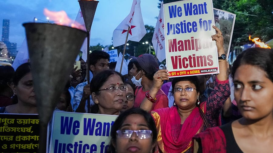 Activists of SFI, DYFI and AIDWA participate in a rally to protest against Manipur's ongoing ethnic violence, in Kolkata. Credit: PTI Photo