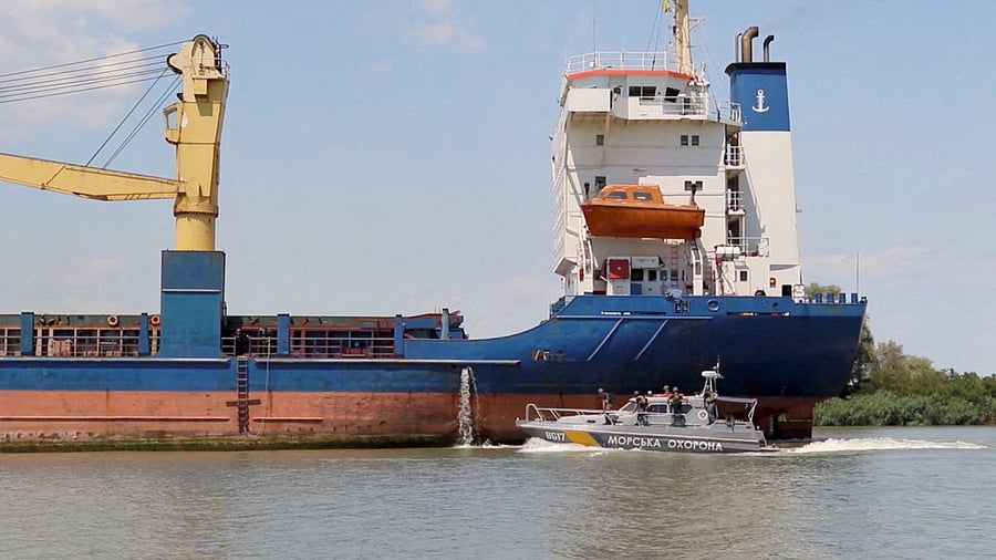 A cargo ship sails followed by a Ukrainian Coast Guard cutter through the Bystre rivermouth, which connects the Black Sea and Danube, at a location given as Izmail district of Odesa region, Ukraine in this screen grab obtained from a handout video released on July 15, 2022. Credit: Operational Command South press service/Handout via Reuters Photo