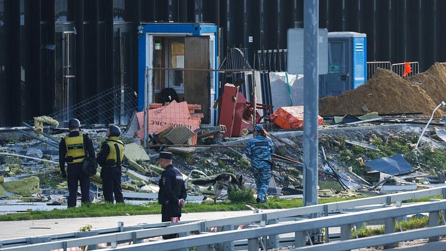 Members of the security services investigate the site of a damaged building following a reported drone attack in Moscow, Russia, July 24, 2023. Credit: Reuters Photo