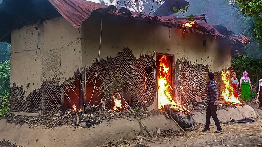 People set ablaze the house of Manipur sexual assault case accused, in Tuinomkhopi. Credit: PTI Photo