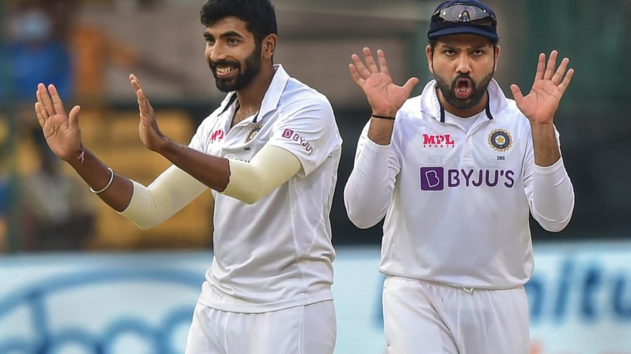 Jasprit Bumrah with Rohit Sharma. Credit: PTI Photo