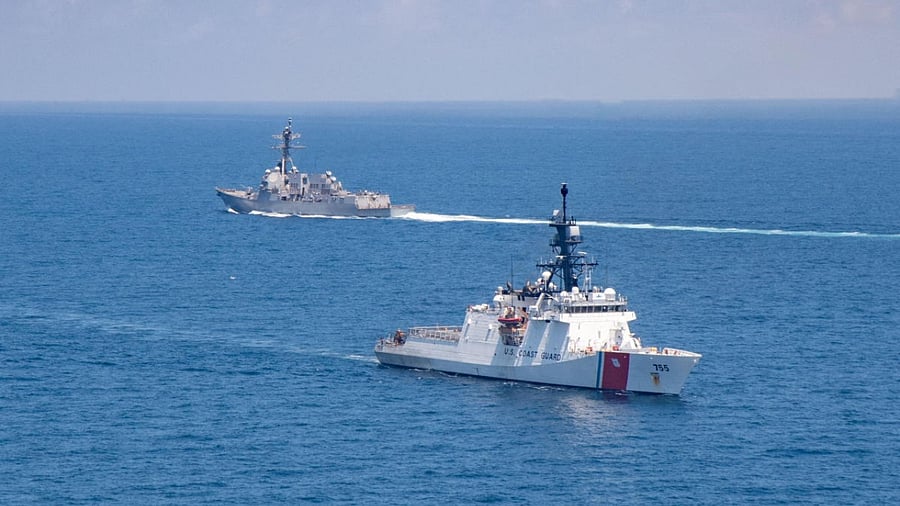The Arleigh Burke-class guided-missile destroyer USS Kidd and U.S. Coast Guard cutter Munro conduct Taiwan Strait transits August 27, 2021. Credit: US Navy handout via Reuters