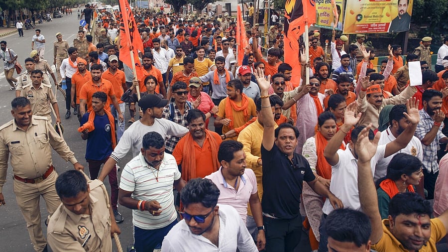 VHP and Bajrang Dal supporters take part in a protest march against the violence that erupted in Haryana's Nuh district, in Noida, Wednesday, August 2, 2023. Credit: PTI Photo