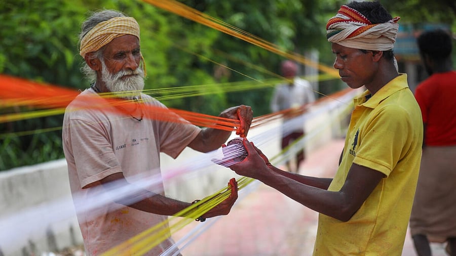 Traditional kite-thread makers prepare glass coated 'Manja' ahead of the demand coinciding with India's Independence Day, in Jammu, Thursday, Aug. 3, 2023. Credit: PTI Photo