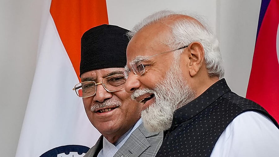  Prime Minister Narendra Modi with Prime Minister of Nepal Pushpa Kamal Dahal 'Prachanda'. Credit: PTI Photo
