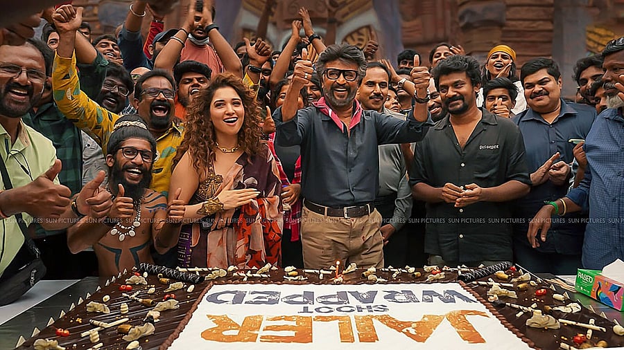 Actors Rajinikanth and Tamannaah Bhatia with director Nelson Dilipkumar celebrate after shooting for their upcoming movie 'Jailer' wrapped up. Credit: PTI Photo