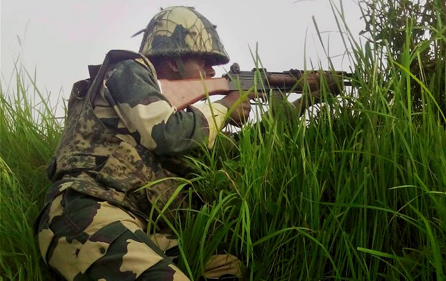Jammu: A BSF jawan at the India-Pakistan border in Arnia Sector near Jammu on Sunday. PTI Photo