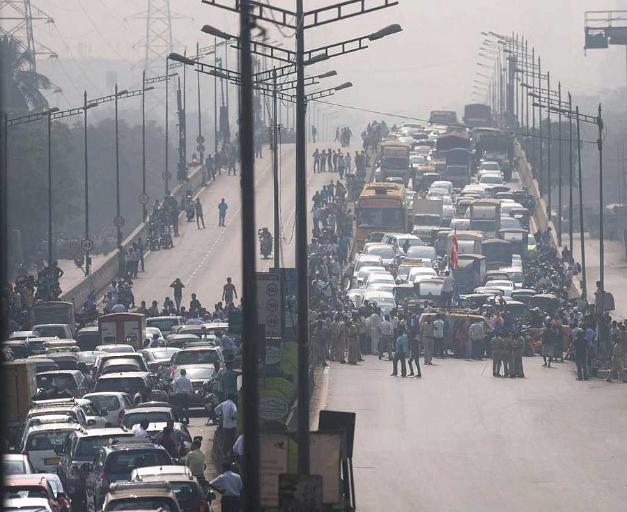  Dalit protesters block the traffic at Western Express Highway near Aarey Check Naka during a 'Rasta Roko' protest over Bhima Koregaon violence, in Mumbai on Wednesday. PTI Photo