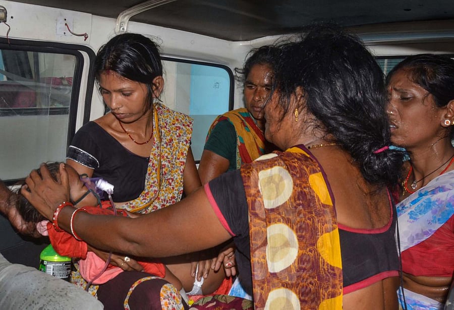 A child showing symptoms of Acute Encephalitis Syndrome (AES) arrives for treatment at a hospital in Muzaffarpur, Wednesday, June 19, 2019. The official figure of deaths is 105, with both the SKMCH hospital and the privately owned Kejriwal hospital in Muzaffarpur reporting one casualty during the night. PTI