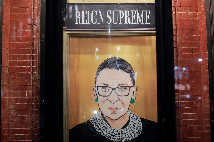 A painting is seen in a storefront on Broadway of Associate Justice of the Supreme Court of the United States Ruth Bader Ginsburg who passed away in Manhattan, New York City. Credit: Reuters