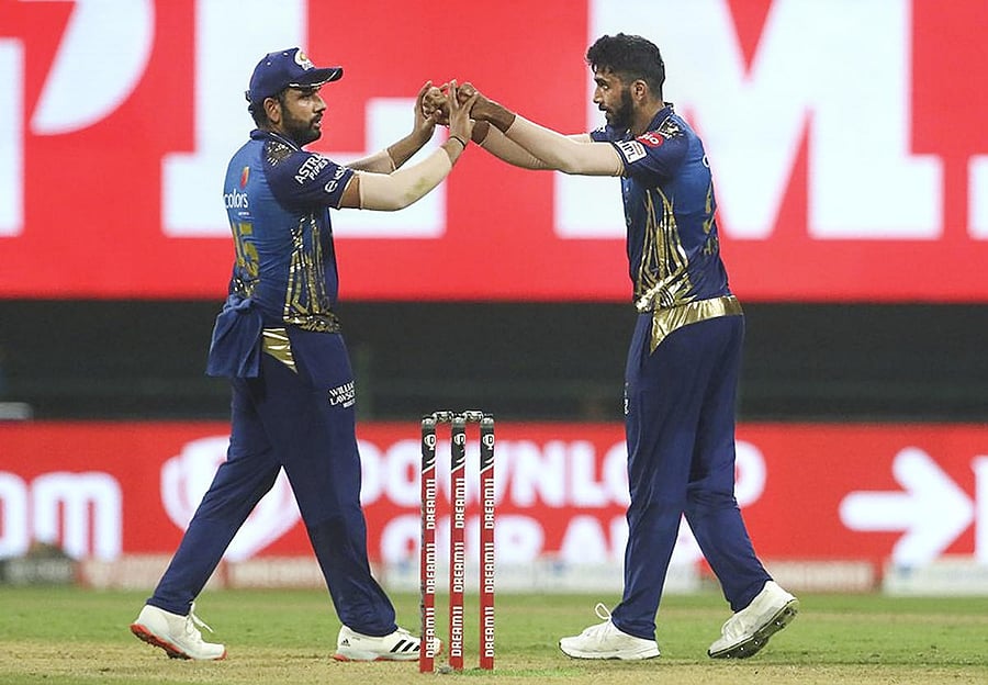 Mumbai Indians player Jasprit Bumra celebrates the wicket of Kolkata Knight Riders batsman Eoin Morgan with his teammates during IPL 2020 cricket match, at Sheikh Zayed Stadium, in Abu Dhabi of United Arab Emirates. Credit: PTI