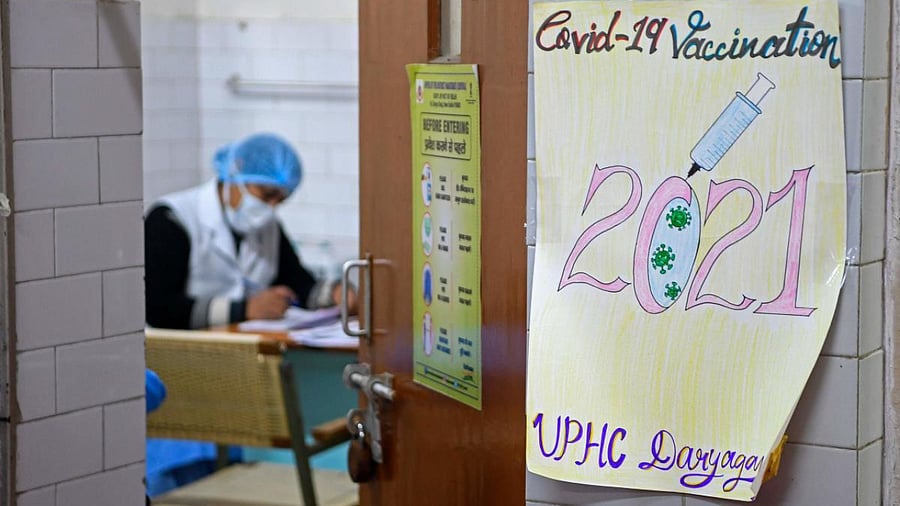 A health official takes part in dry run or a mock drill for Covid-19 coronavirus vaccine delivery at a health center in New Delhi. Credit: AFP Photo