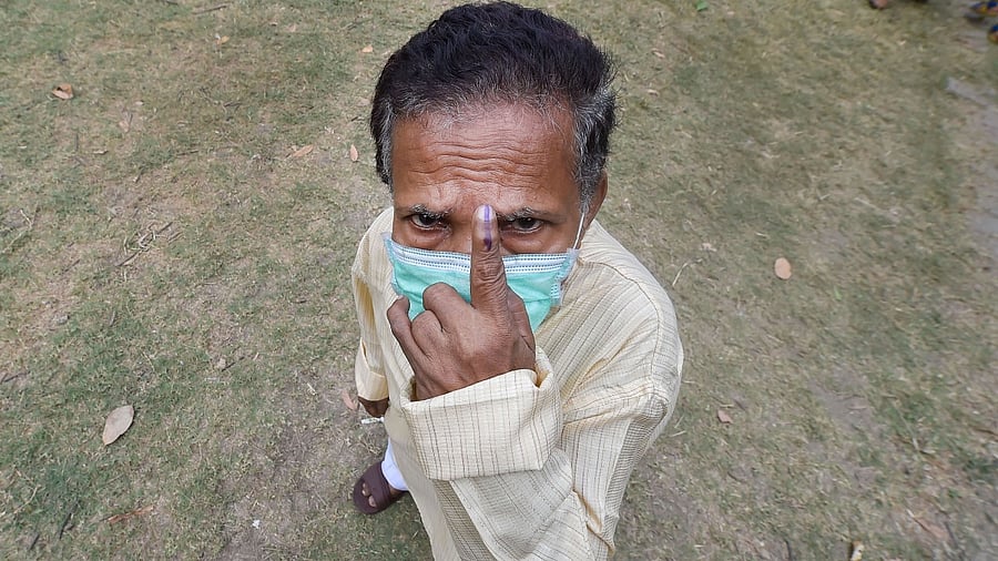 <div class="paragraphs"><p>A midget person shows his finger marked with indelible ink after casting his vote at a polling station, during the fourth phase of Assembly poll in Kolkata. Image for representation only.&nbsp;</p></div>