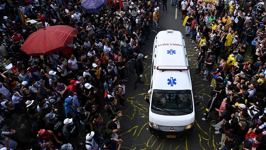 Demonstrators allow an ambulance to pass by during a new protest against the government in Medellin, Colombia. Credit: AFP Photo