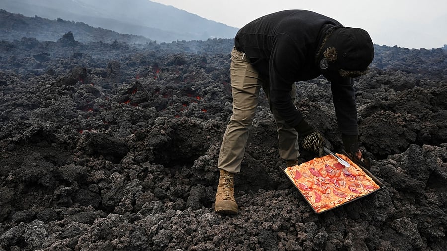 In Pics | Guatemalan Man serves pizza cooked on volcano's molten lava